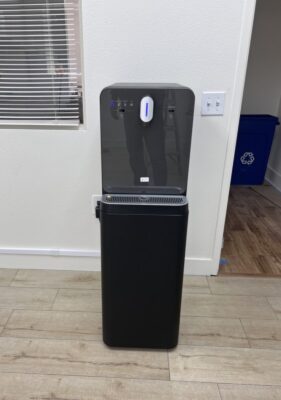 Bottleless water cooler installed in a commercial office near a hallway