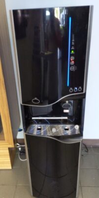 Bottleless water and ice cooler installed in an office lobby