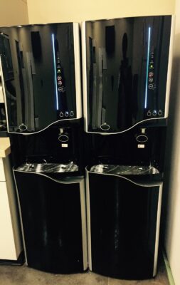 Two bottleless water and ice machines installed in an office breakroom