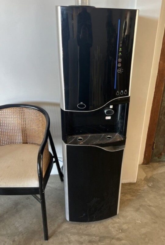 Point-of-use water cooler installed in an office break room